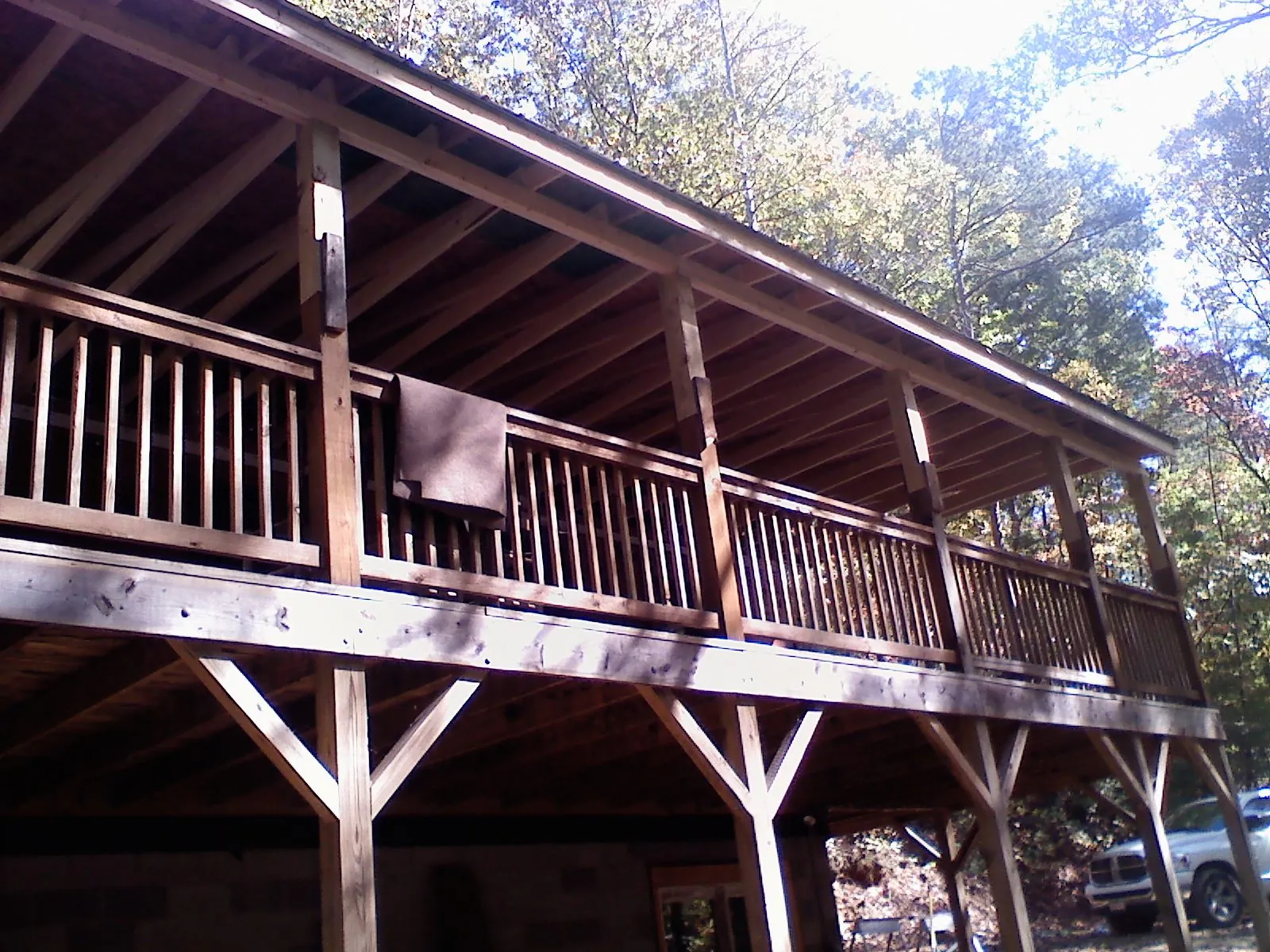Timber framing under a new elevated porch and deck — Roof Leak Repair in Maryland Heights by Roofing Brothers